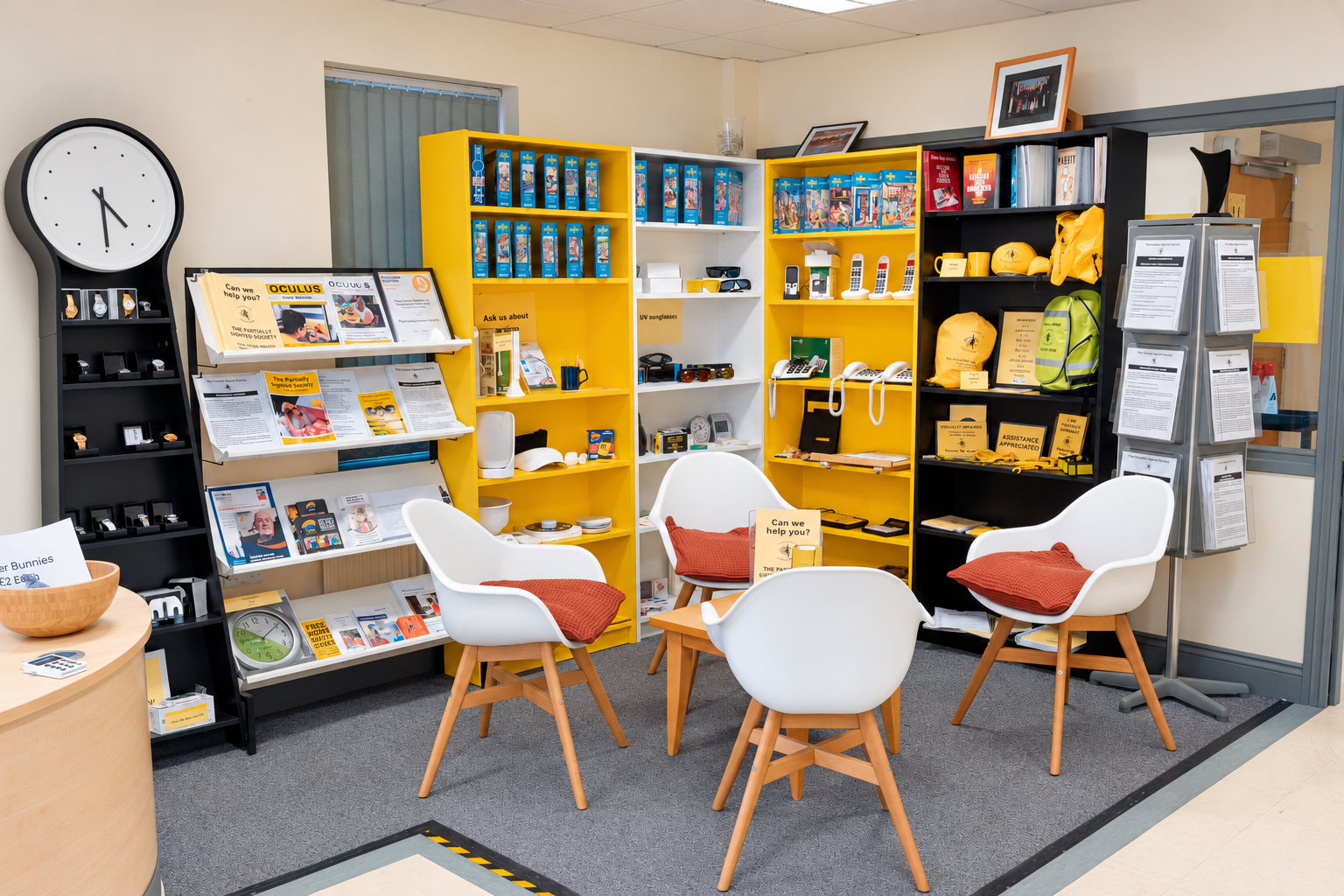 Reception and waiting area at the Partially Sighted Society, with chairs and displays of low vision aids.